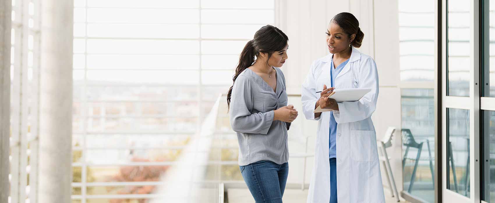 Diabetes doctor answering her patient's questions in a hospital.