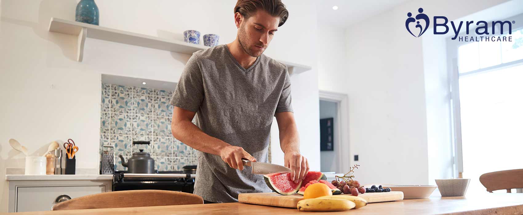 Man preparing food in his kitchen.