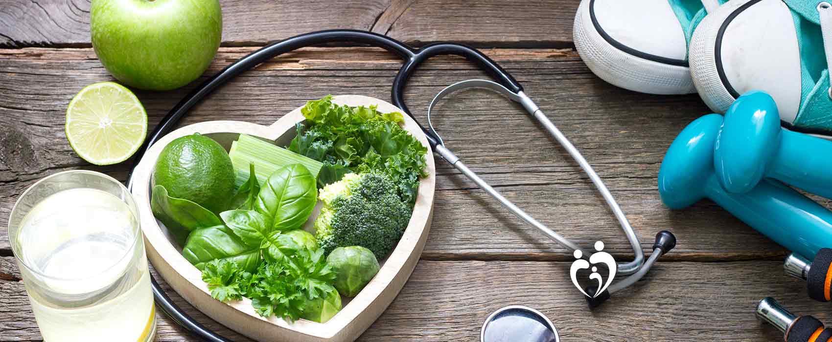 healthy food on table with exercise equipment