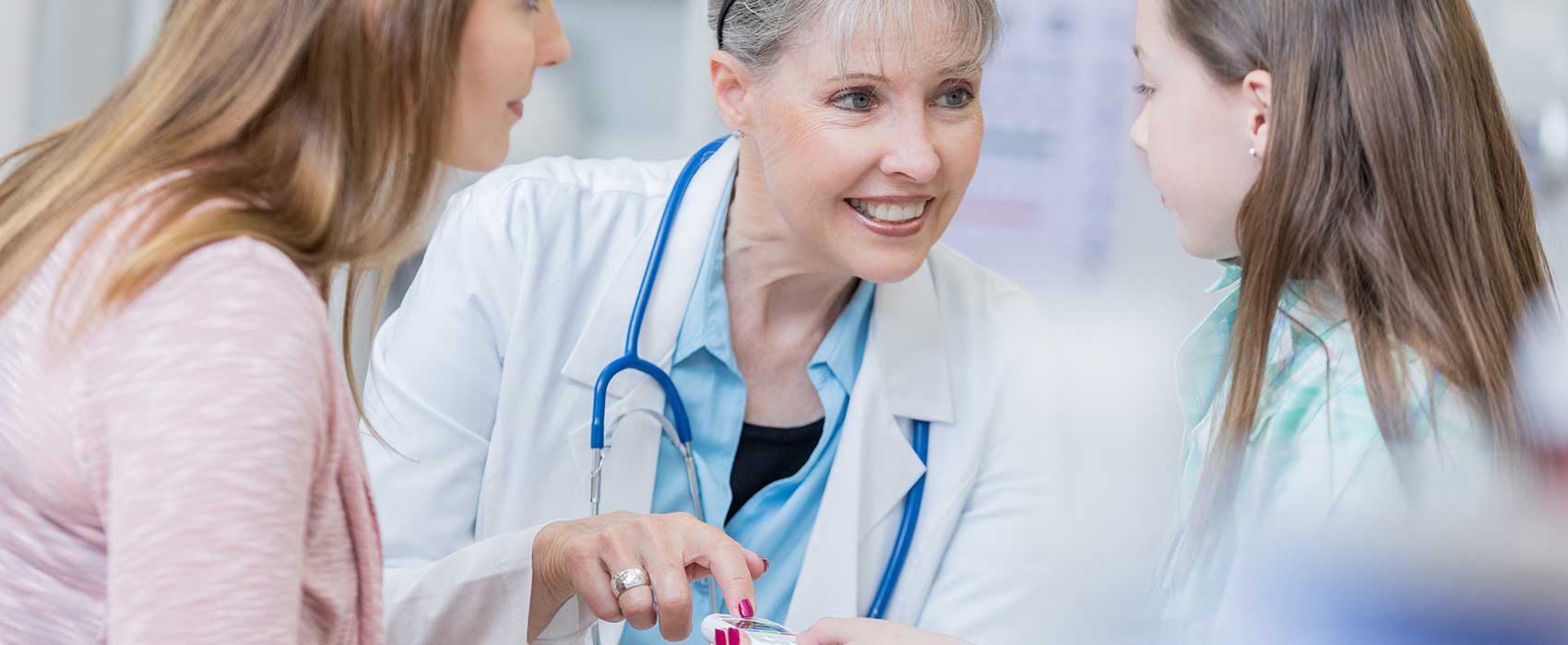 doctor with mother and daughter