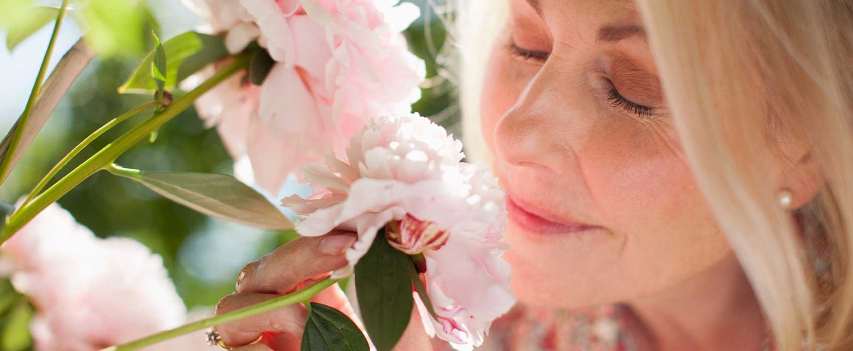 woman smelling flowers
