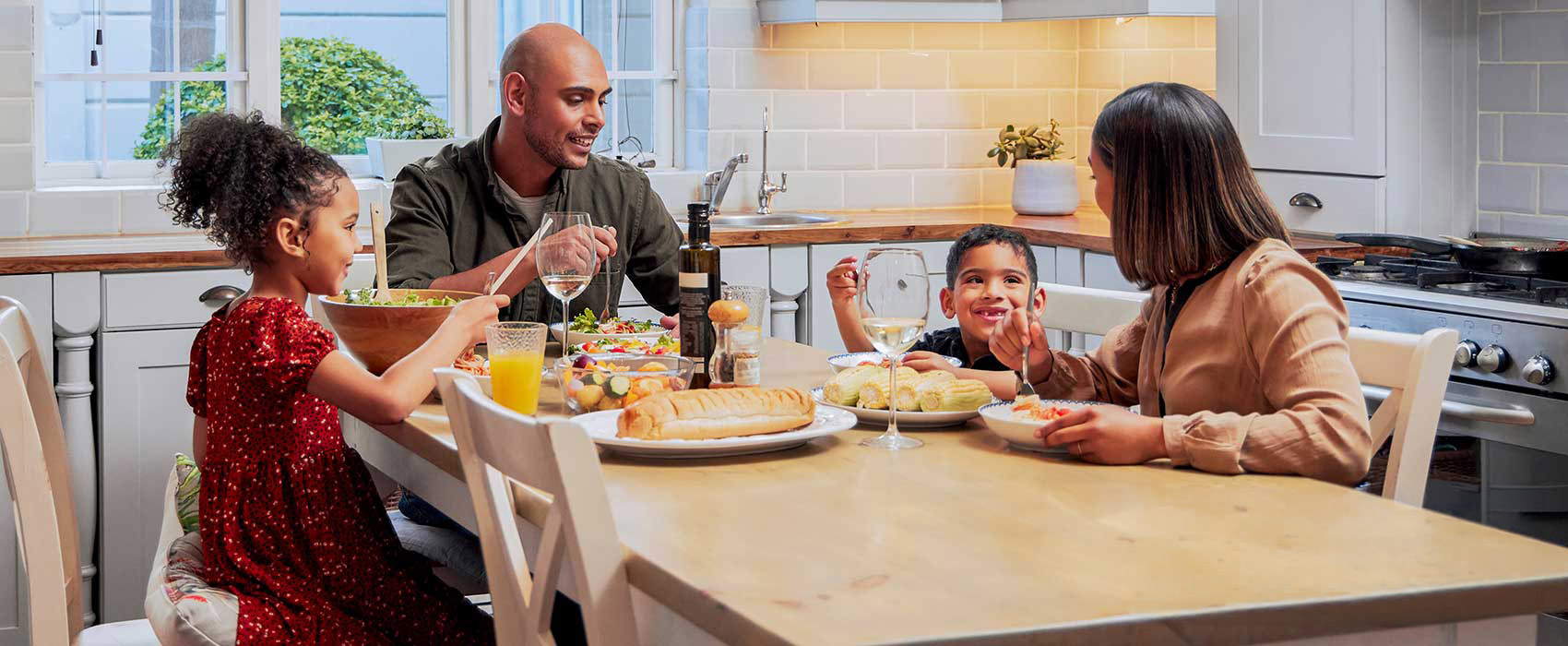 Family eating at a dinner table.