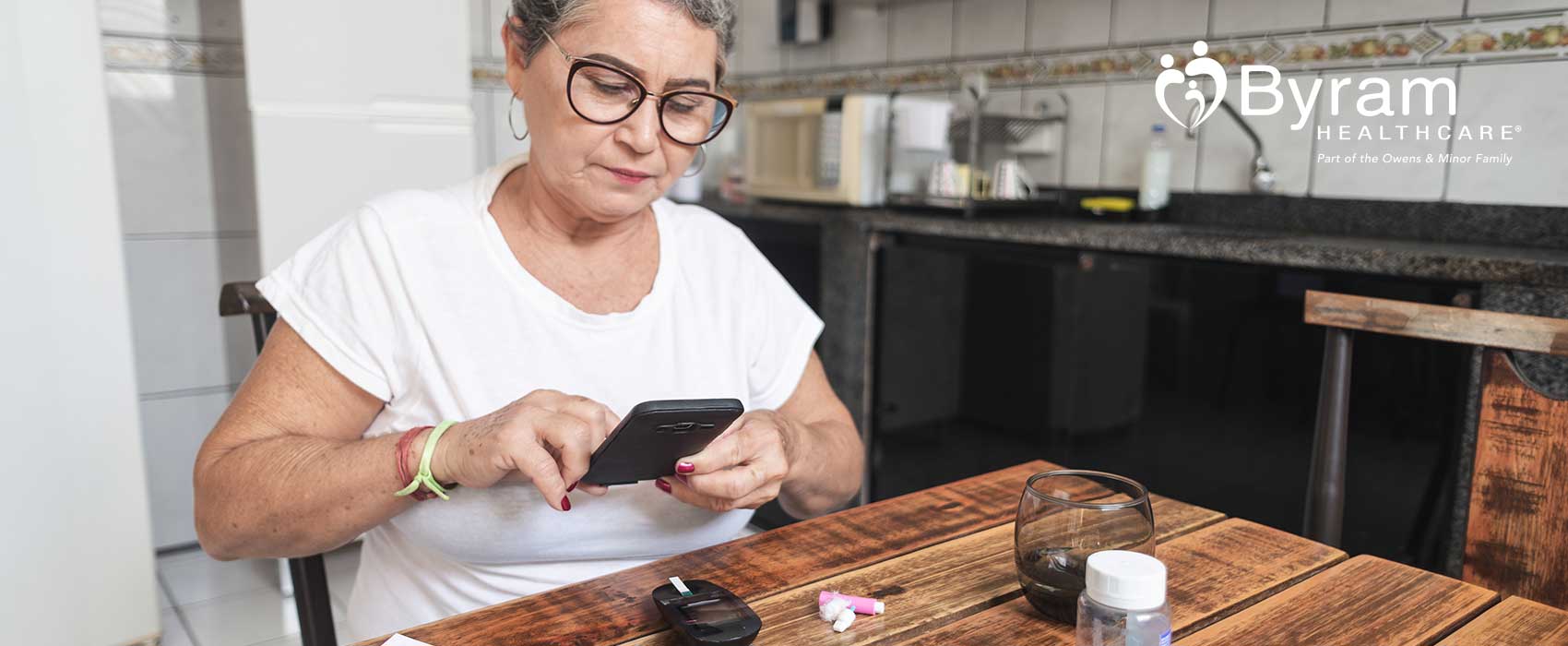 Woman using her phone for diabetes management.
