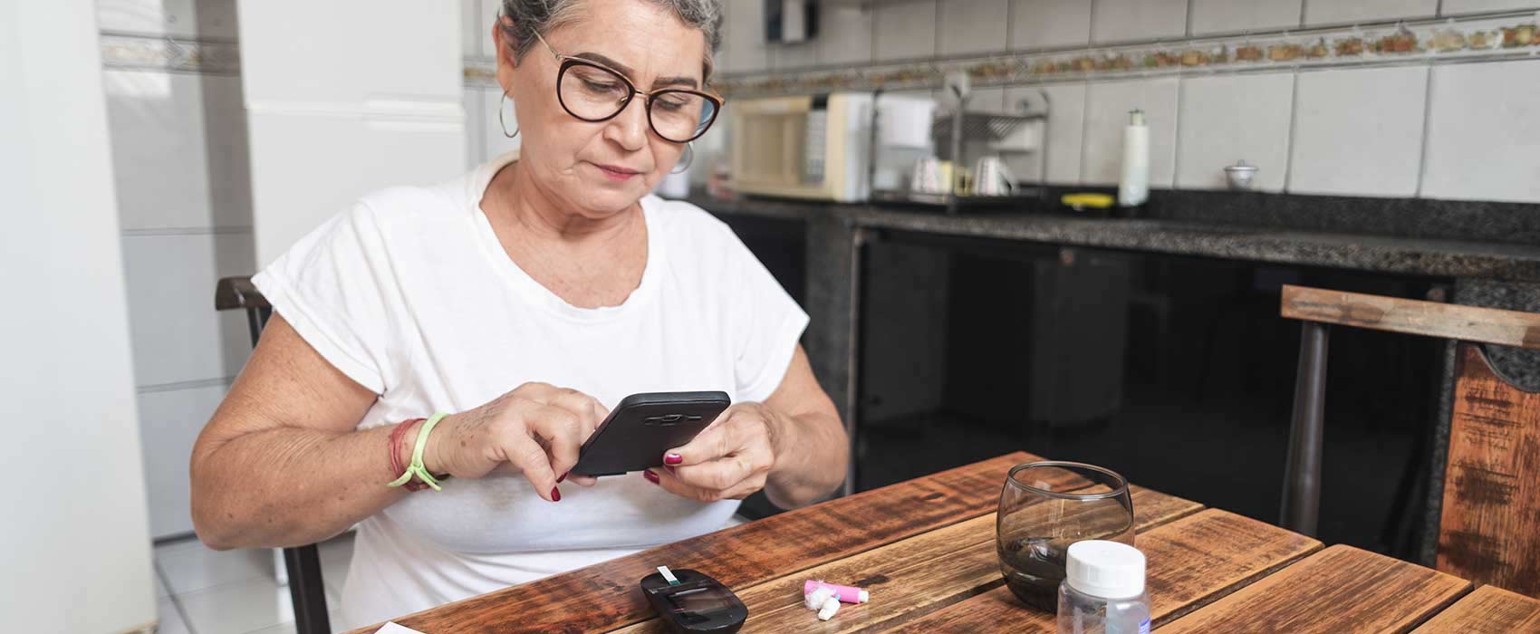 Woman using her phone for diabetes management.