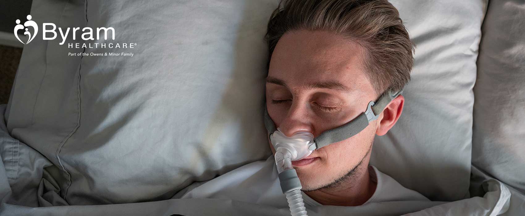 Man sleeping with a CPAP machine.