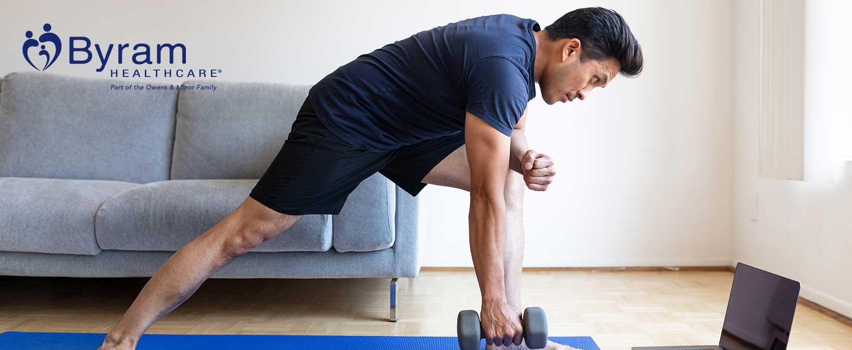 Man using dumbbell to exercise.