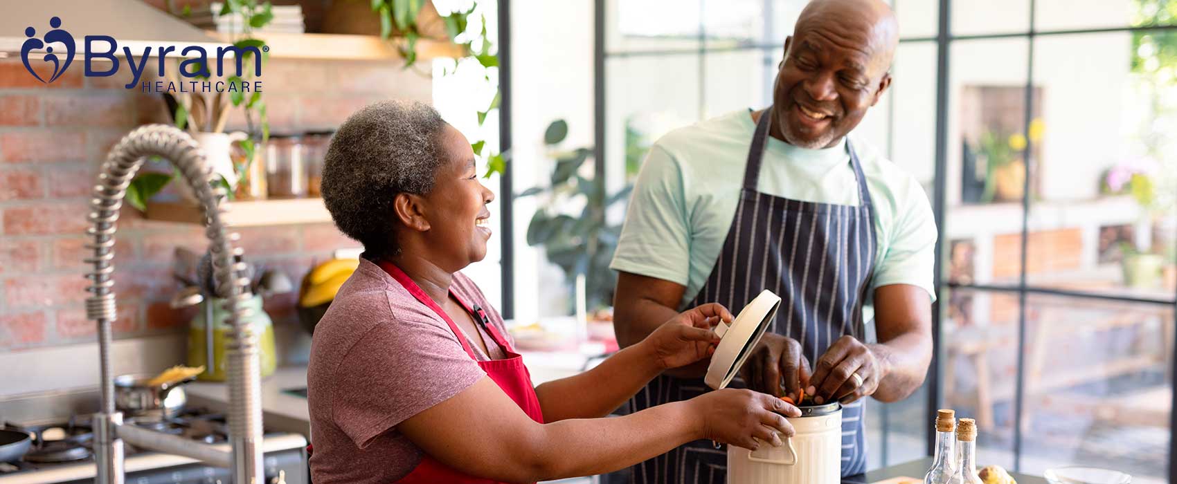 Man and woman cooking in a kitchen.