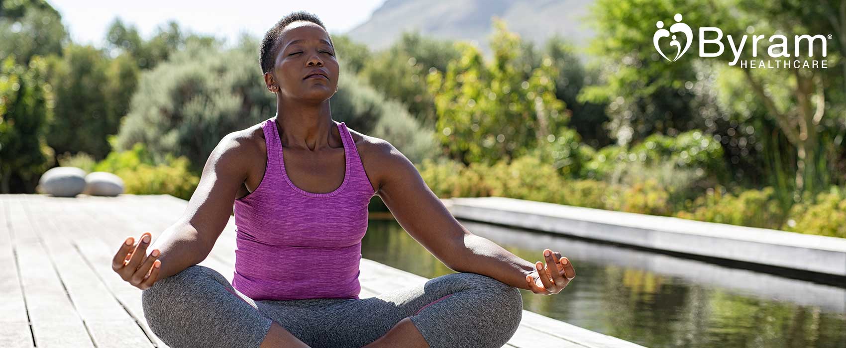 Woman meditating outside.