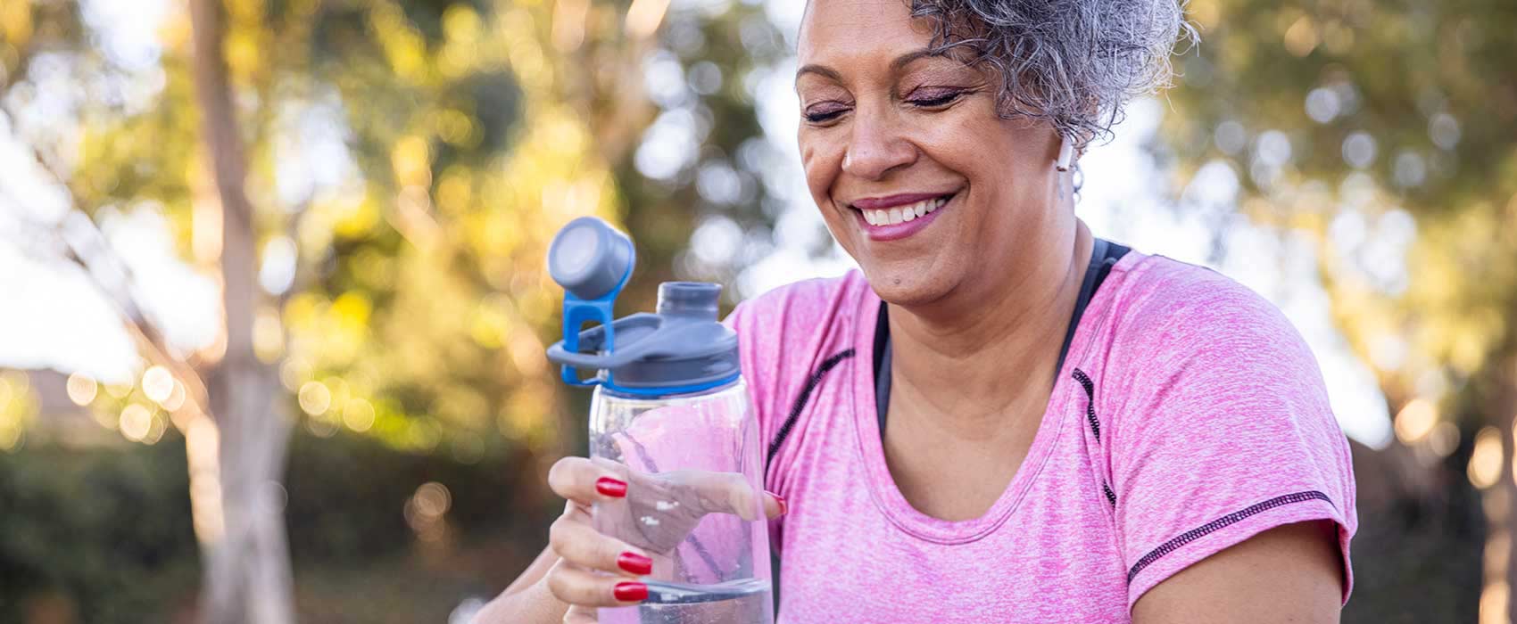 Woman holding a water bottle.