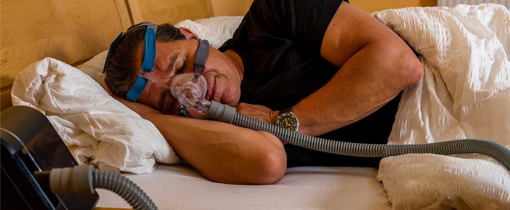 Man using his CPAP machine.