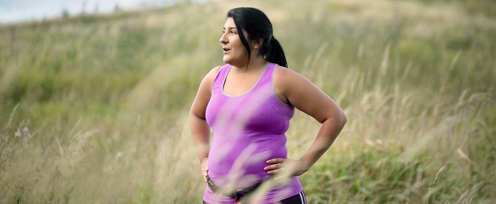 Woman standing in a grassy field