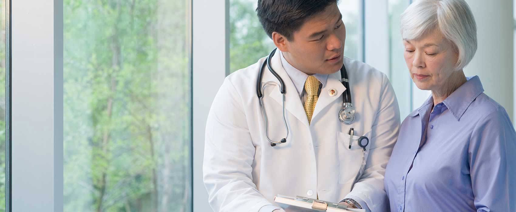 Doctor explaining something to his patient.