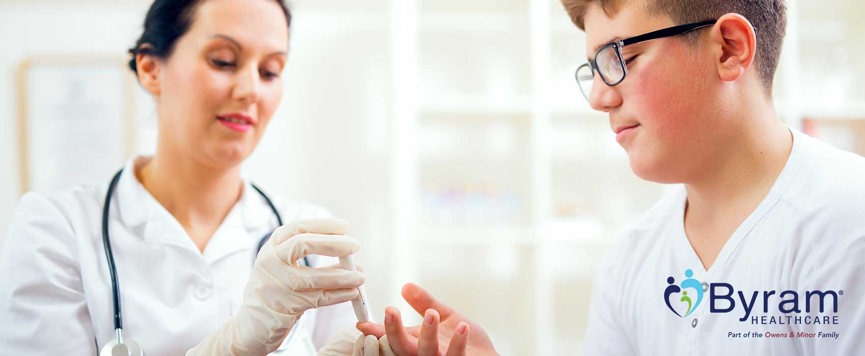Doctor testing a patient's blood sugar.