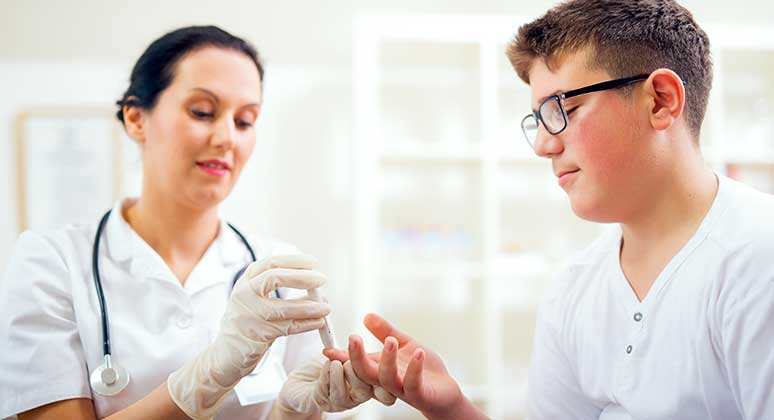 Doctor testing a patient's blood sugar.