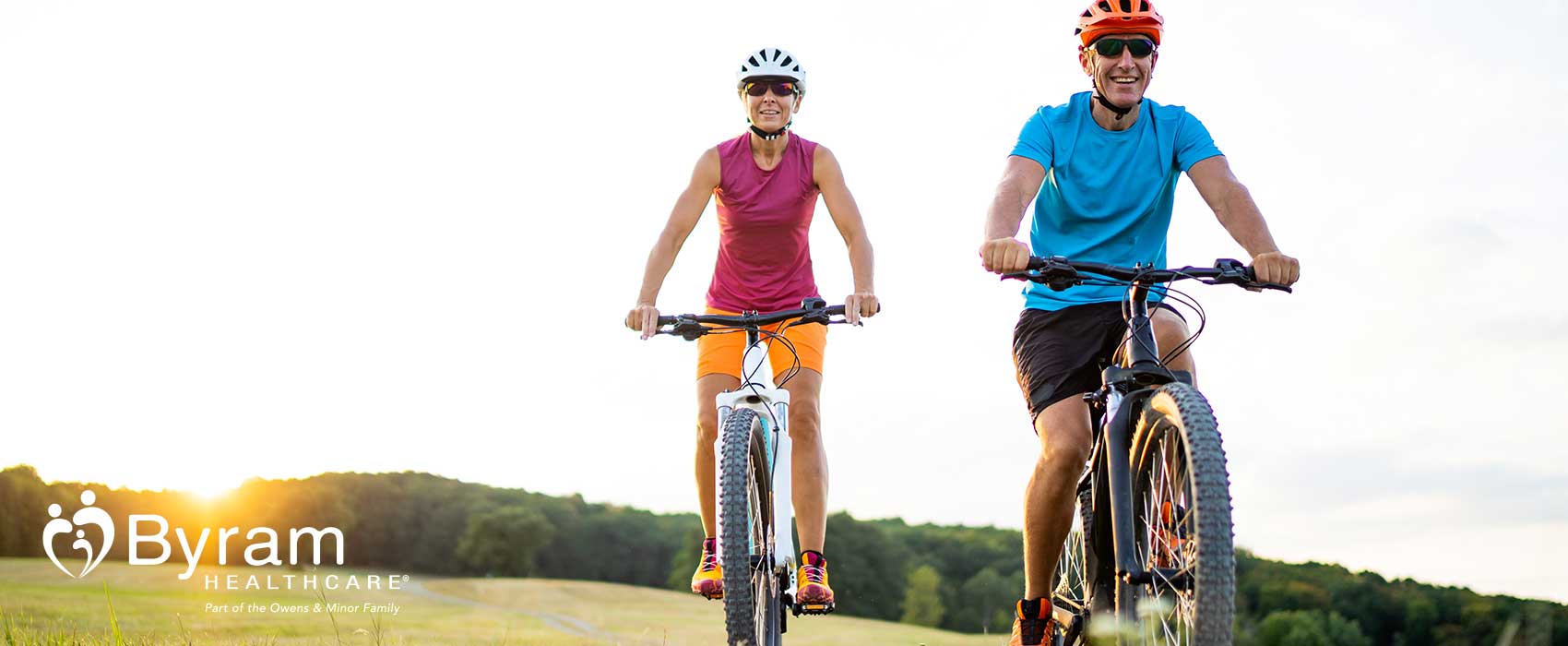 Man and woman riding bikes.