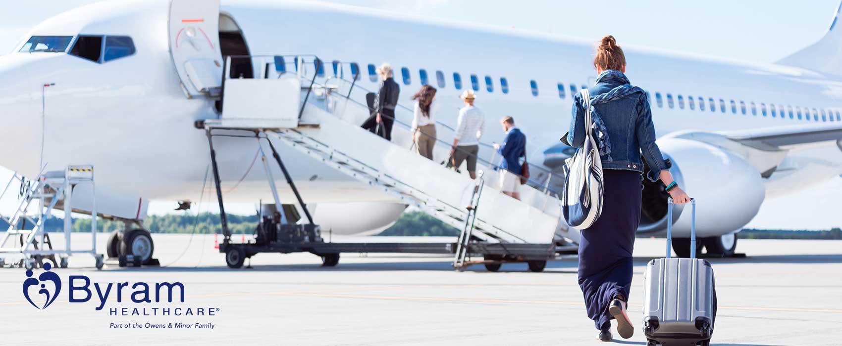 Woman getting on an airplane.