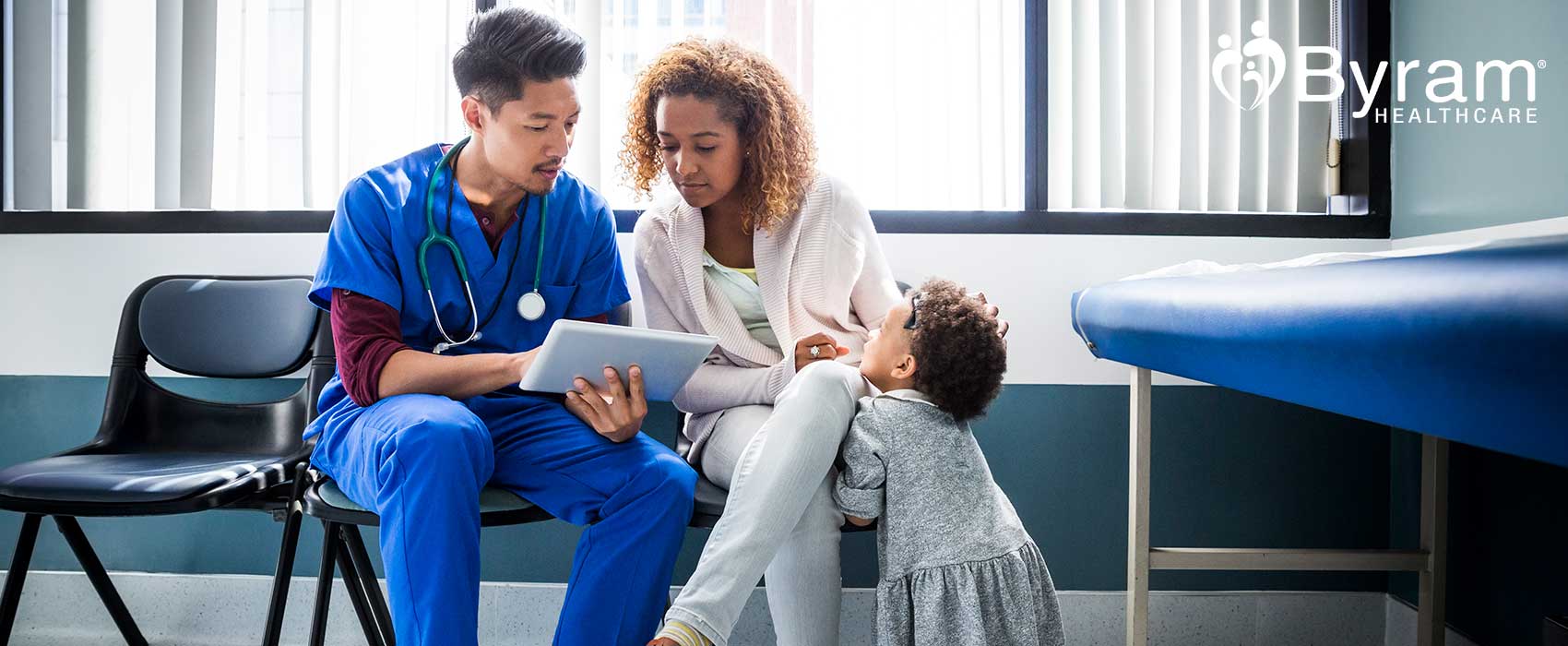 Doctor showing a woman ostomy products on an iPad.