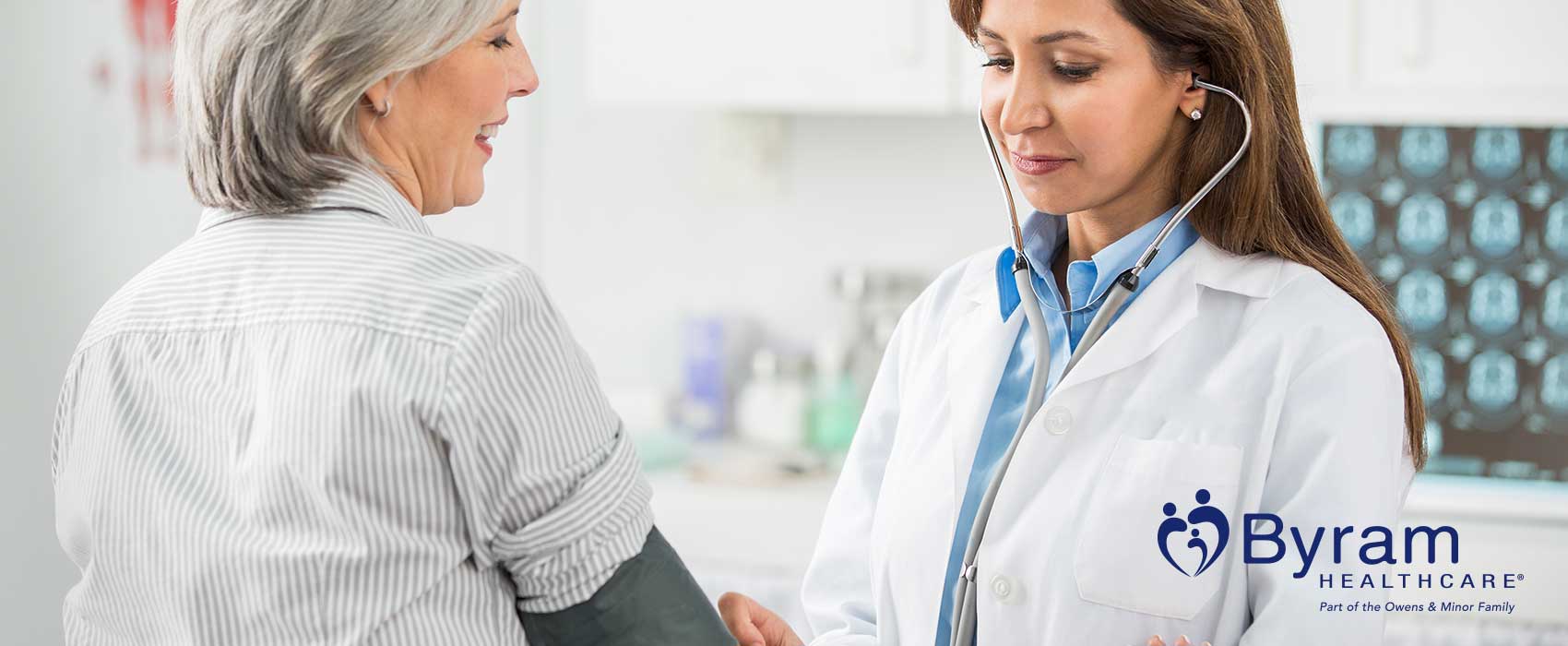 Doctor using stethoscope on patient.