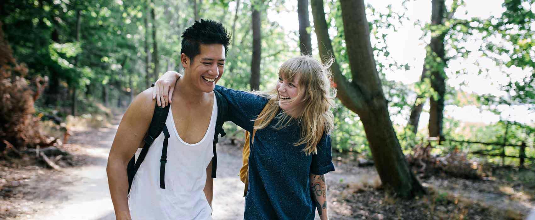Couple walking in forest