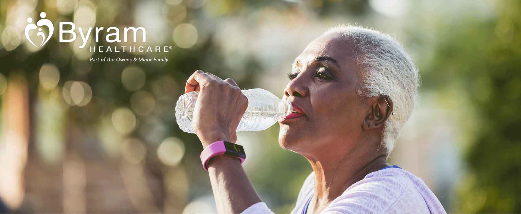 Woman Drinking Water Outdoors