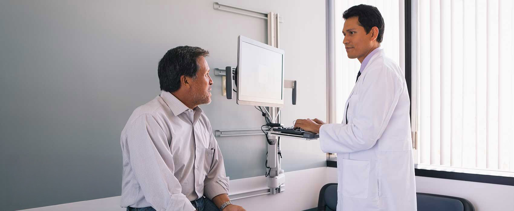 Man talking to his doctor.