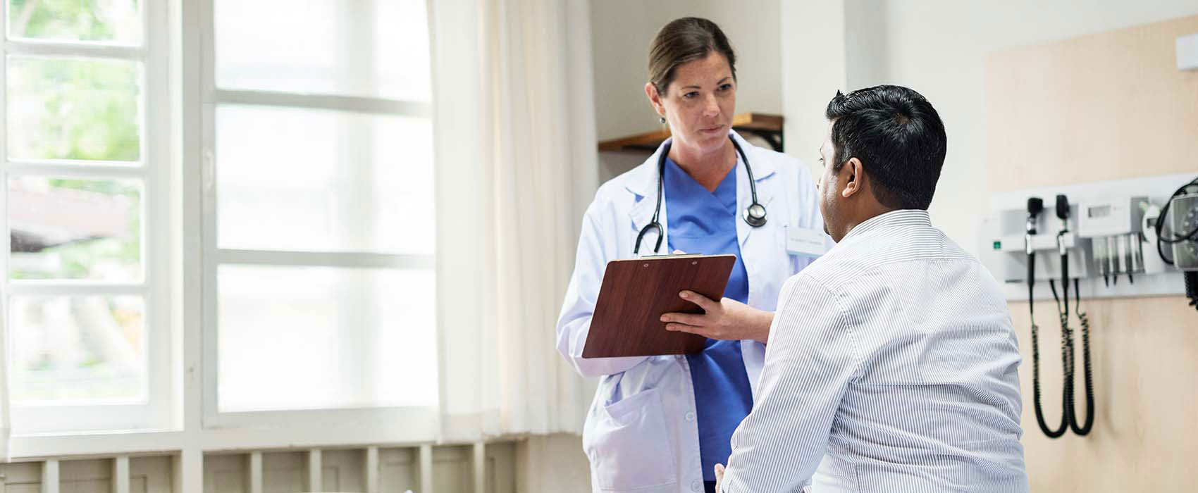 Doctor talking to her patient.