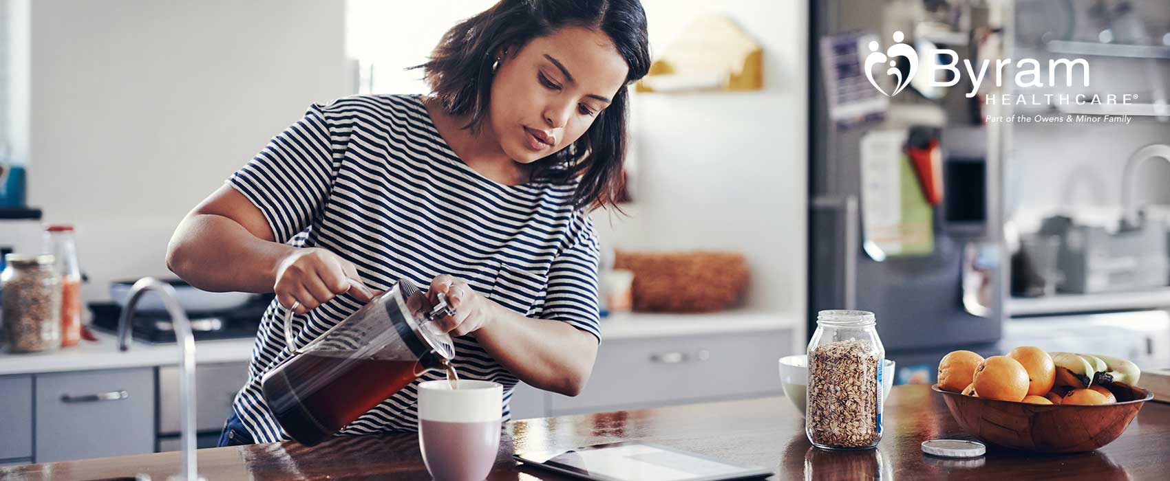 Woman pouring a cup of coffee.