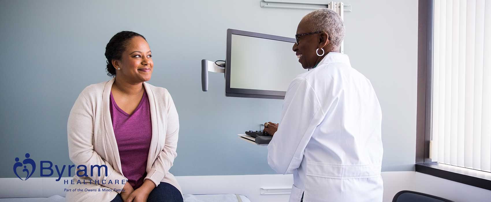 Woman talking to her urologist.