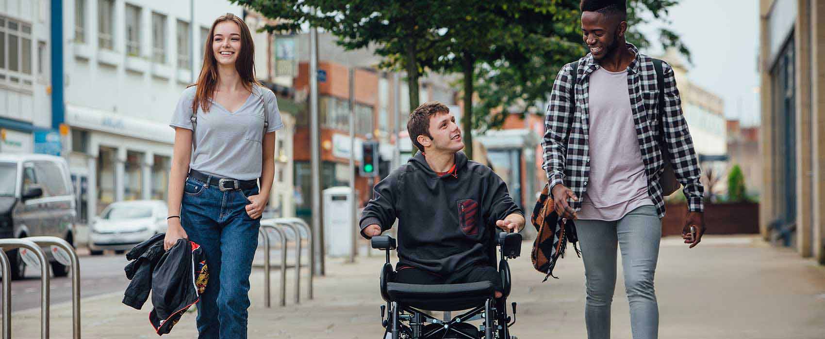 Person with quadriplegia hanging out with friends.
