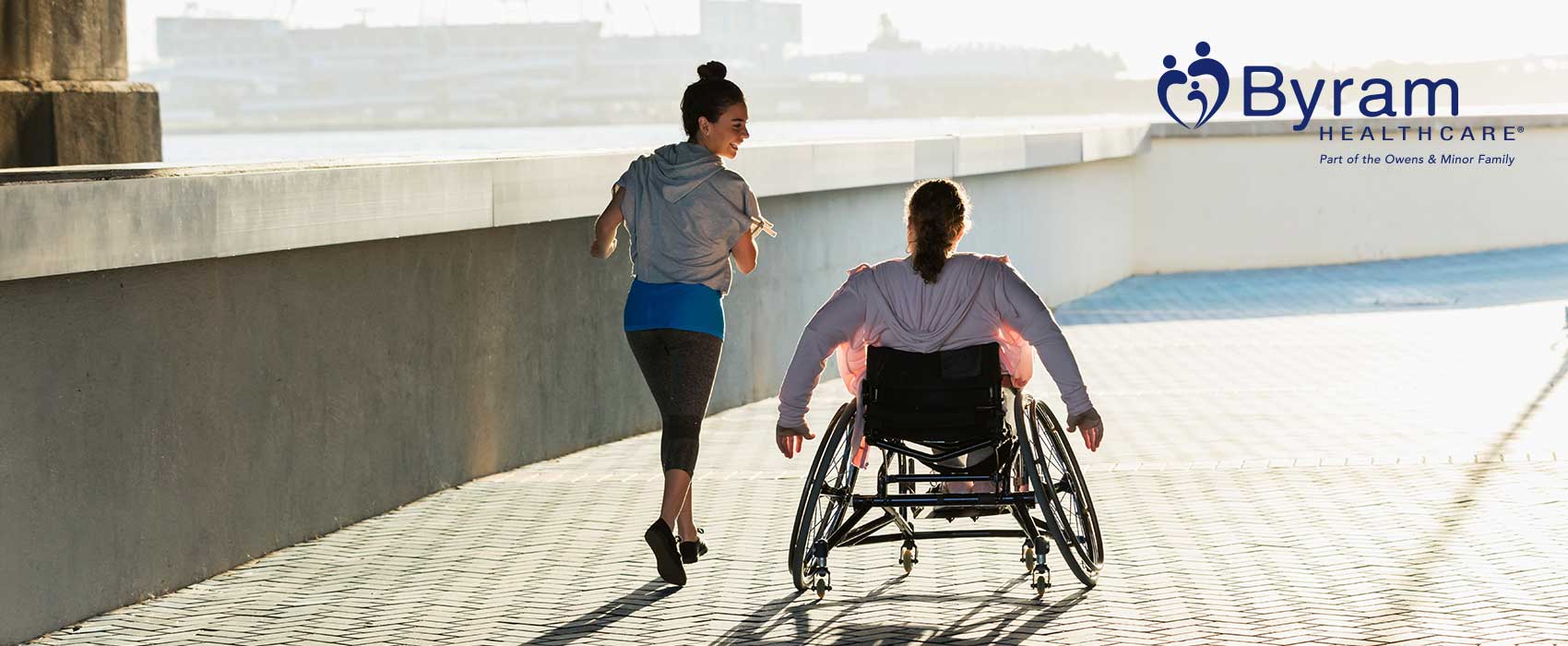 Two women exercising on a sunny day.