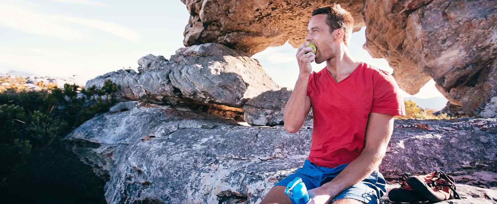 Man eating an apple.