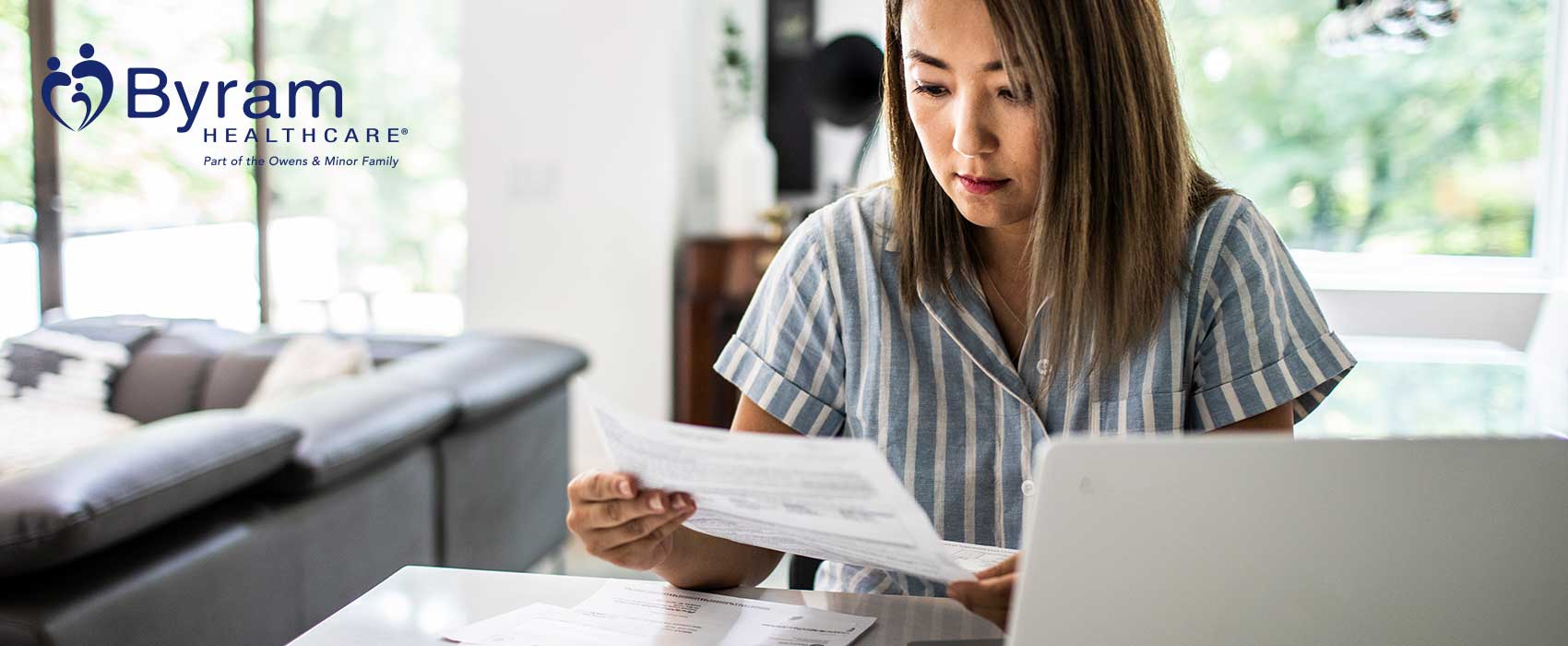 Woman looking at medical bills.