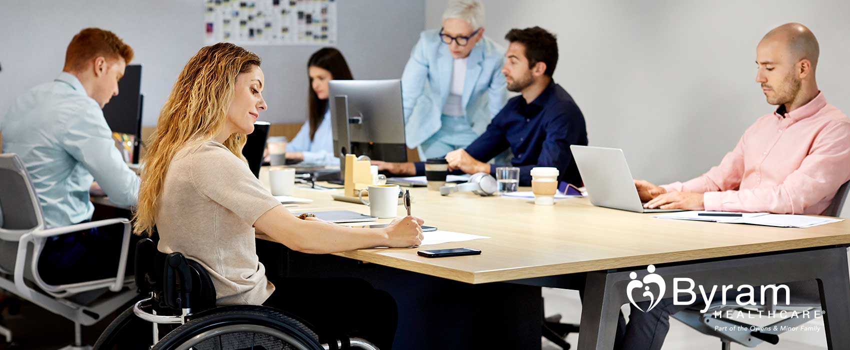 Woman in a wheelchair working.