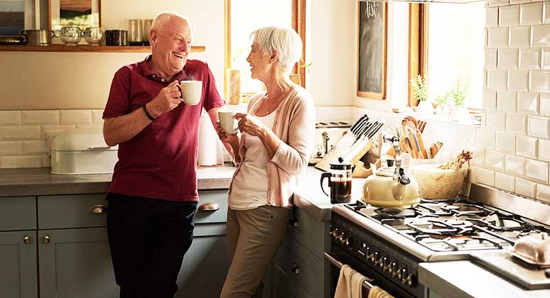 Older couple having coffee.