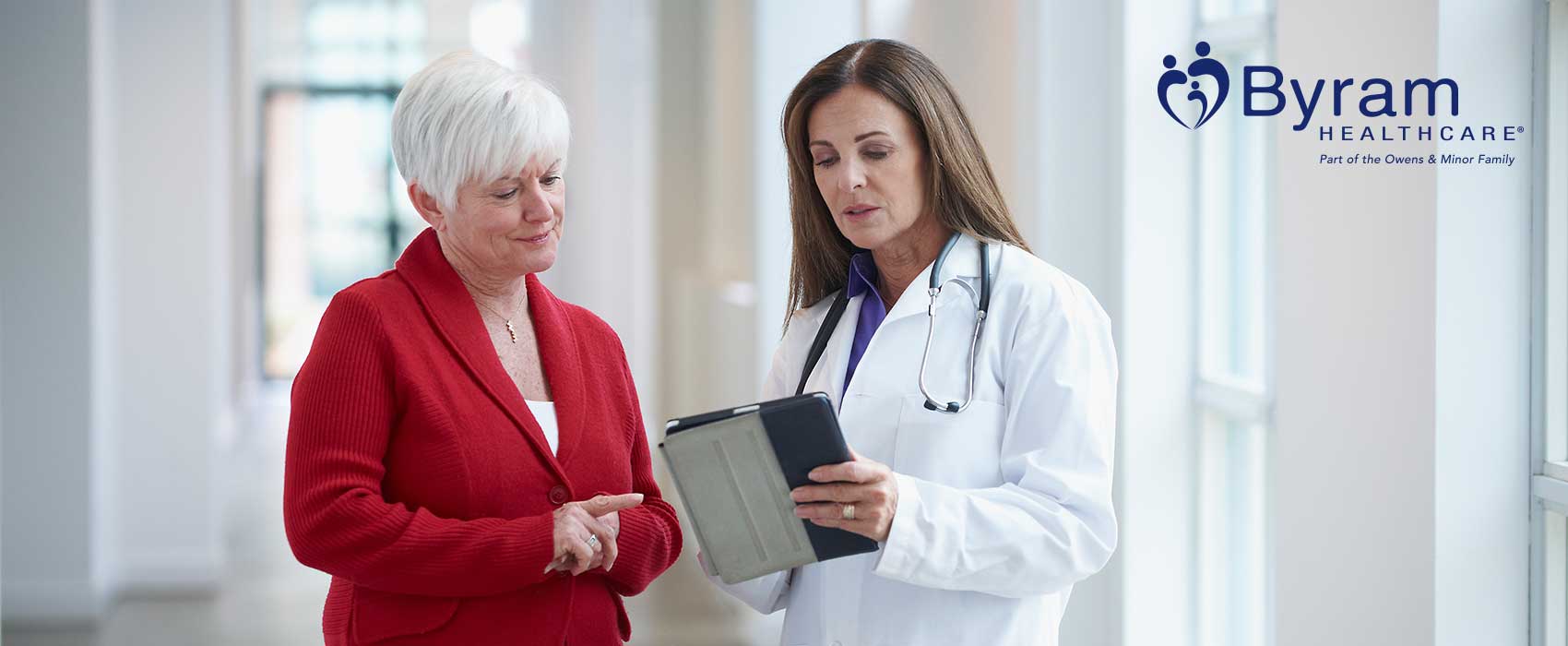 Elder woman talking to her physician.