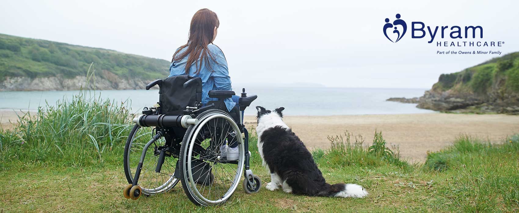 Woman in a wheelchair by a lake.