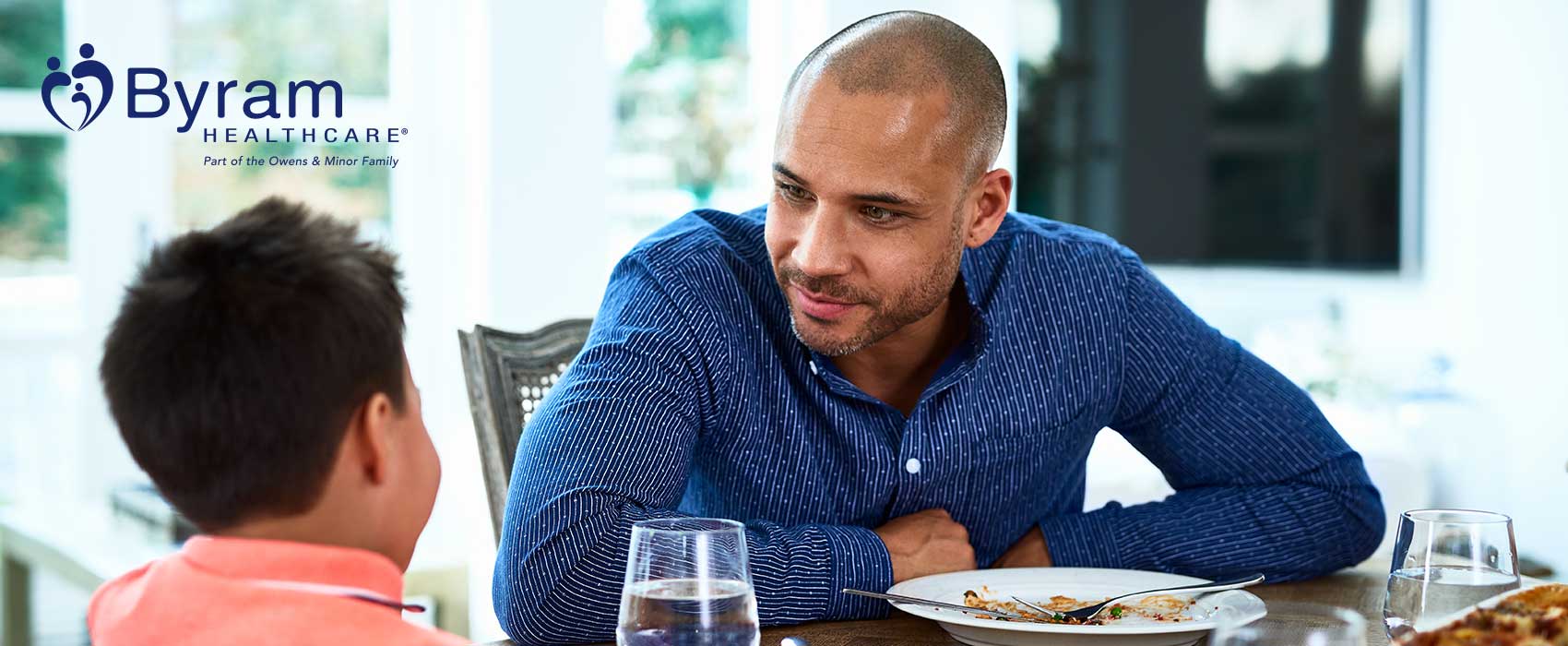 Father and son at the dinner table.