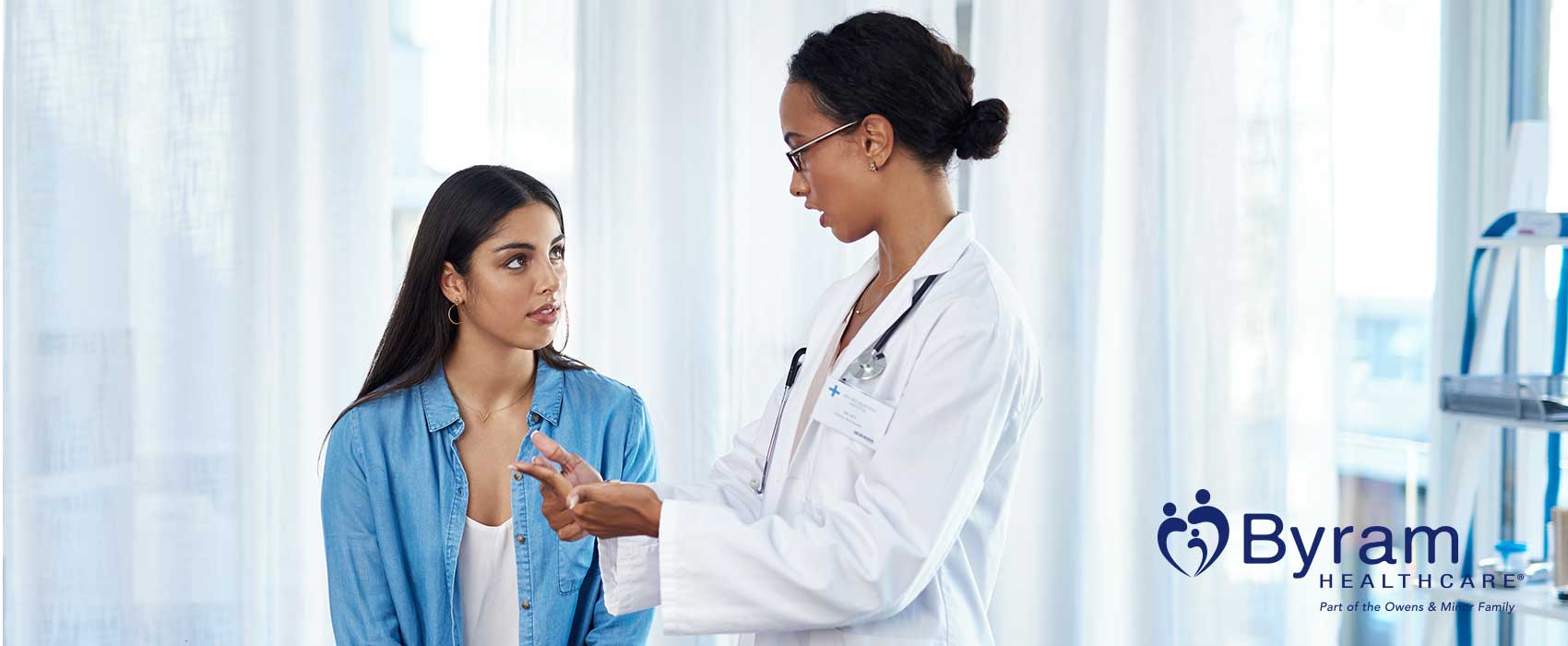 Urologist talking to her patient.