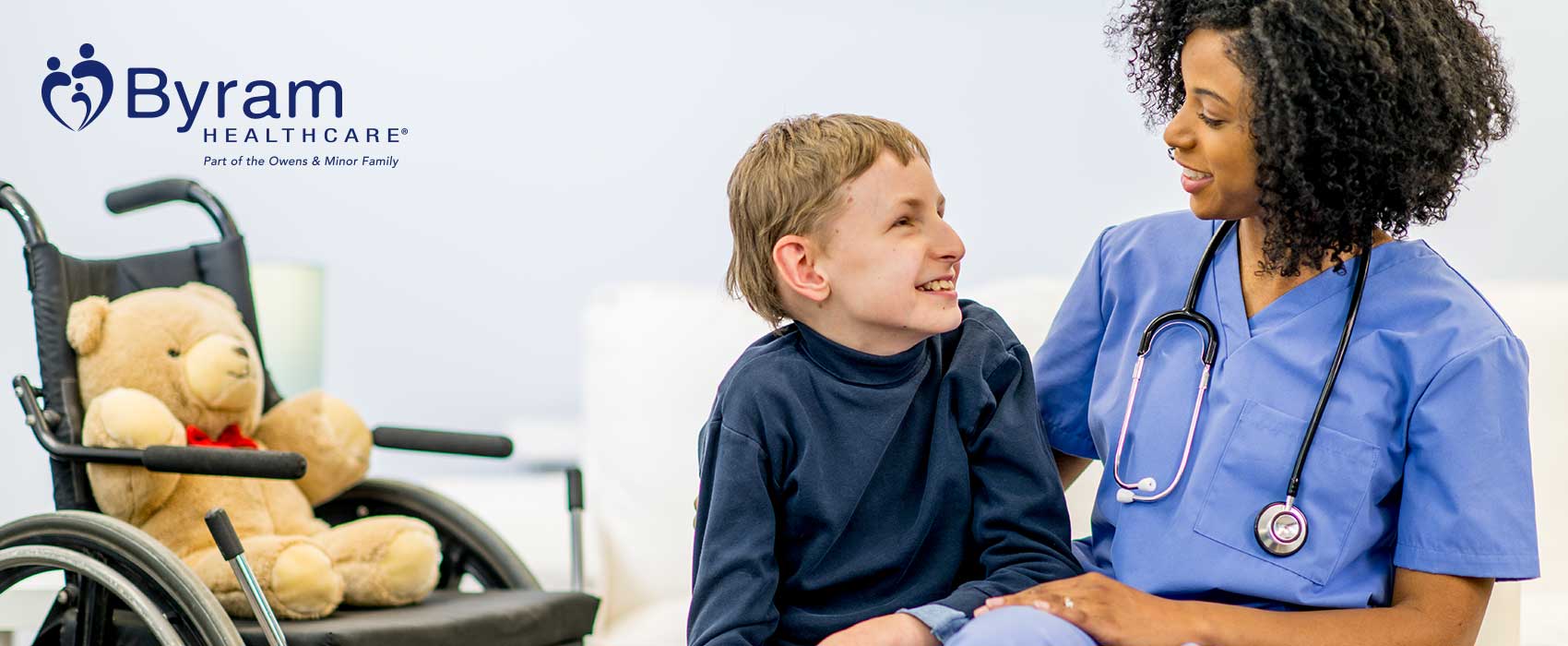 Young boy talking to a nurse