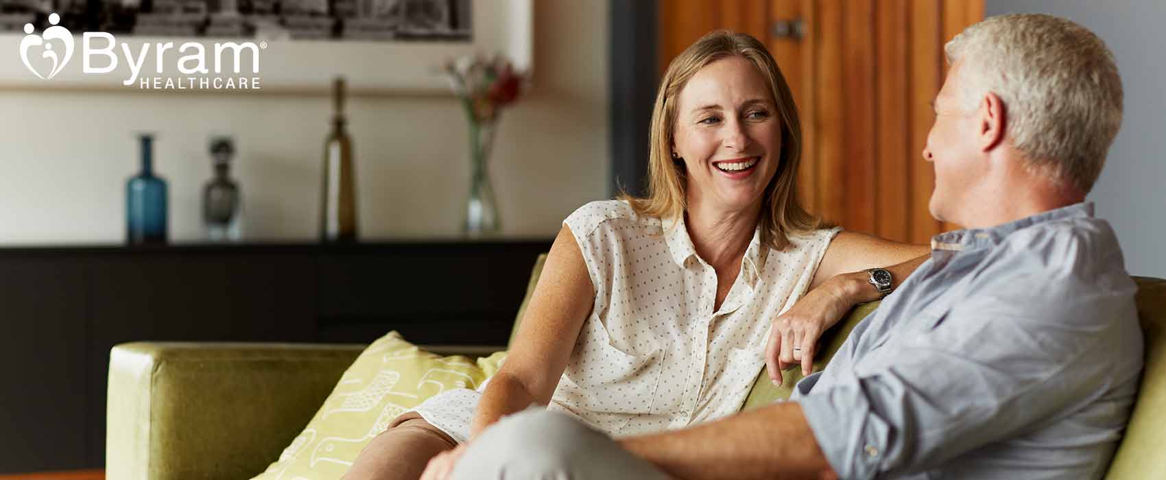 Man and woman sitting on a couch.