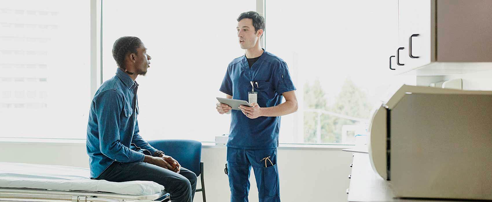 Doctor explaining something to his patient.