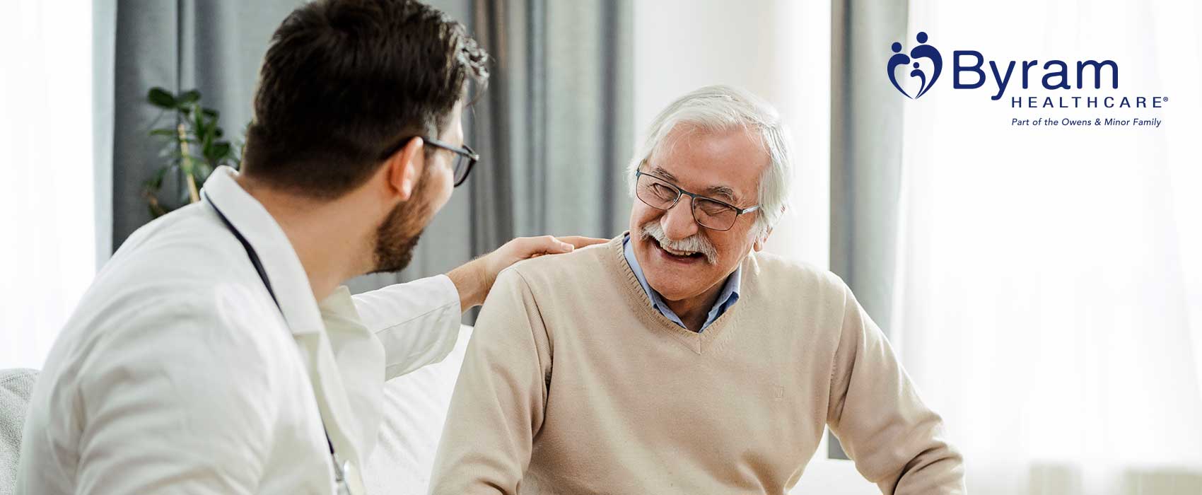 Doctor talking to his smiling patient