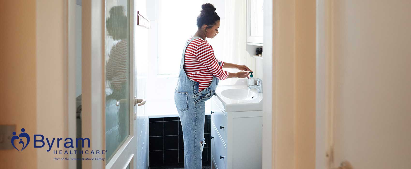 Woman washing her hands.