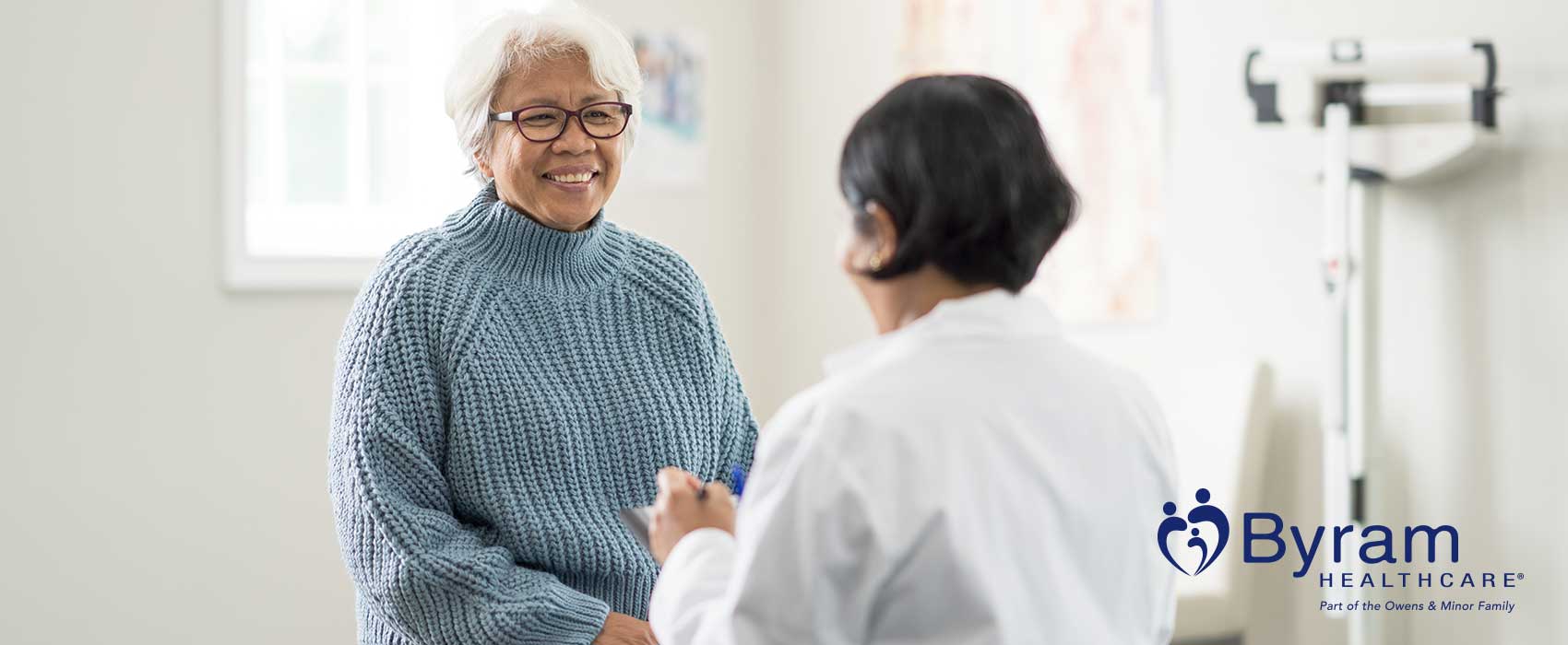 Doctor talking to her older patient.