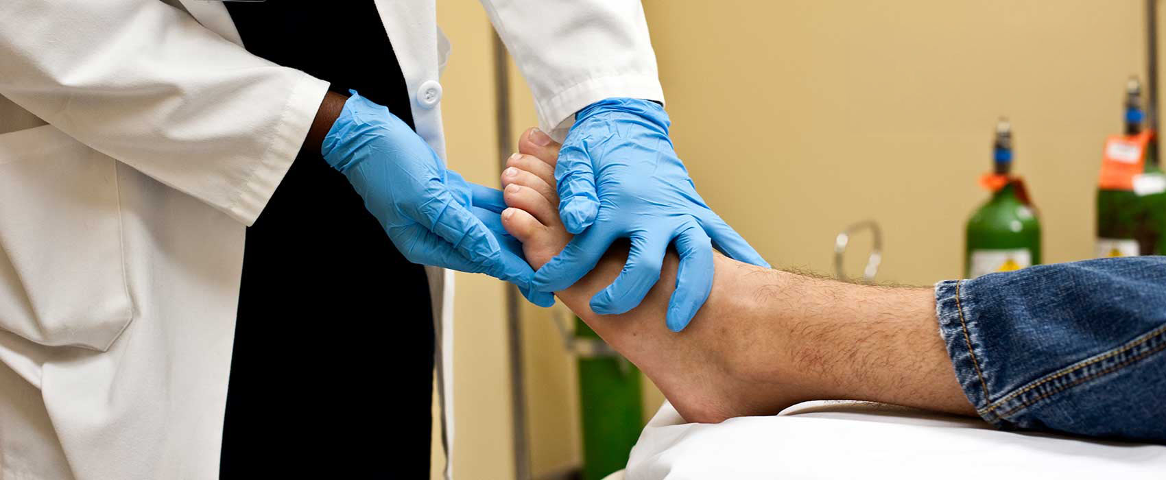 Doctor touching patient's foot.