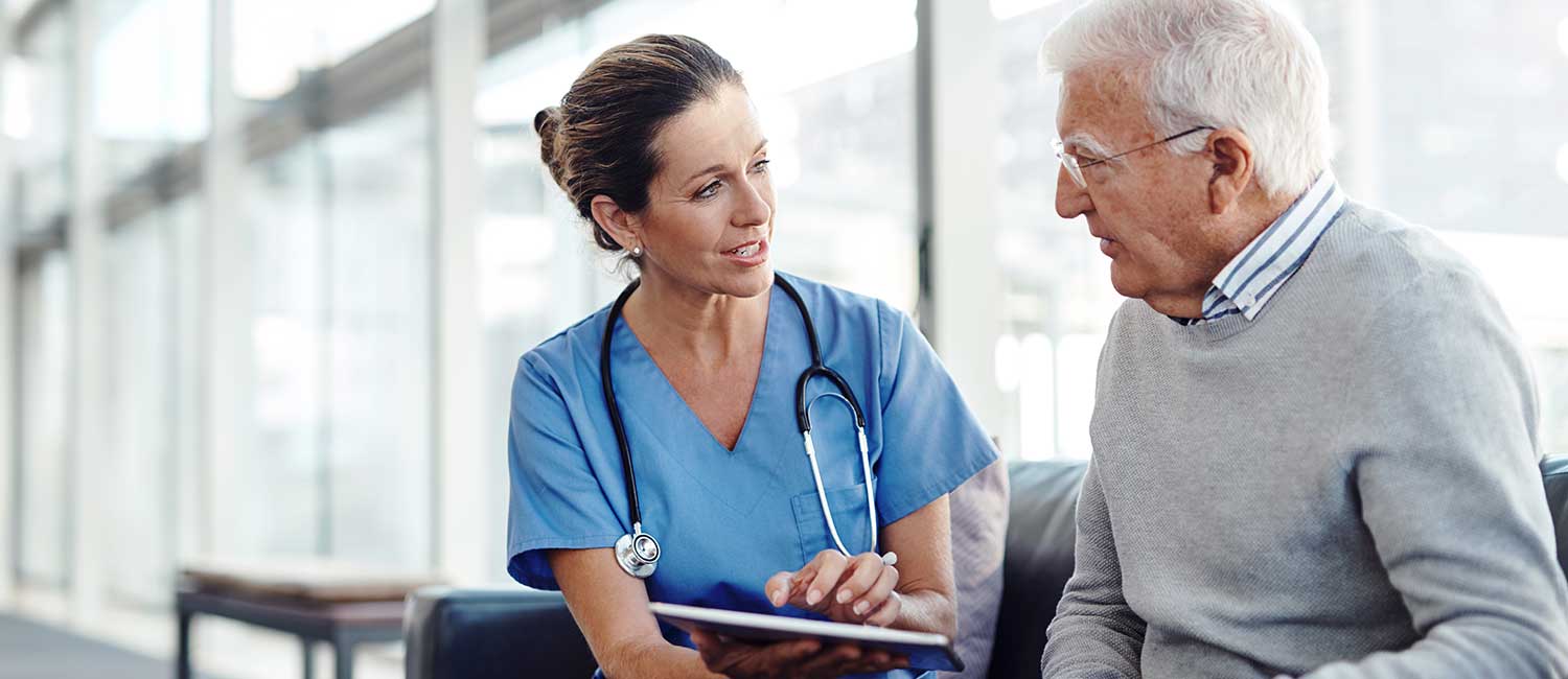 Nurse Talking to Older Man