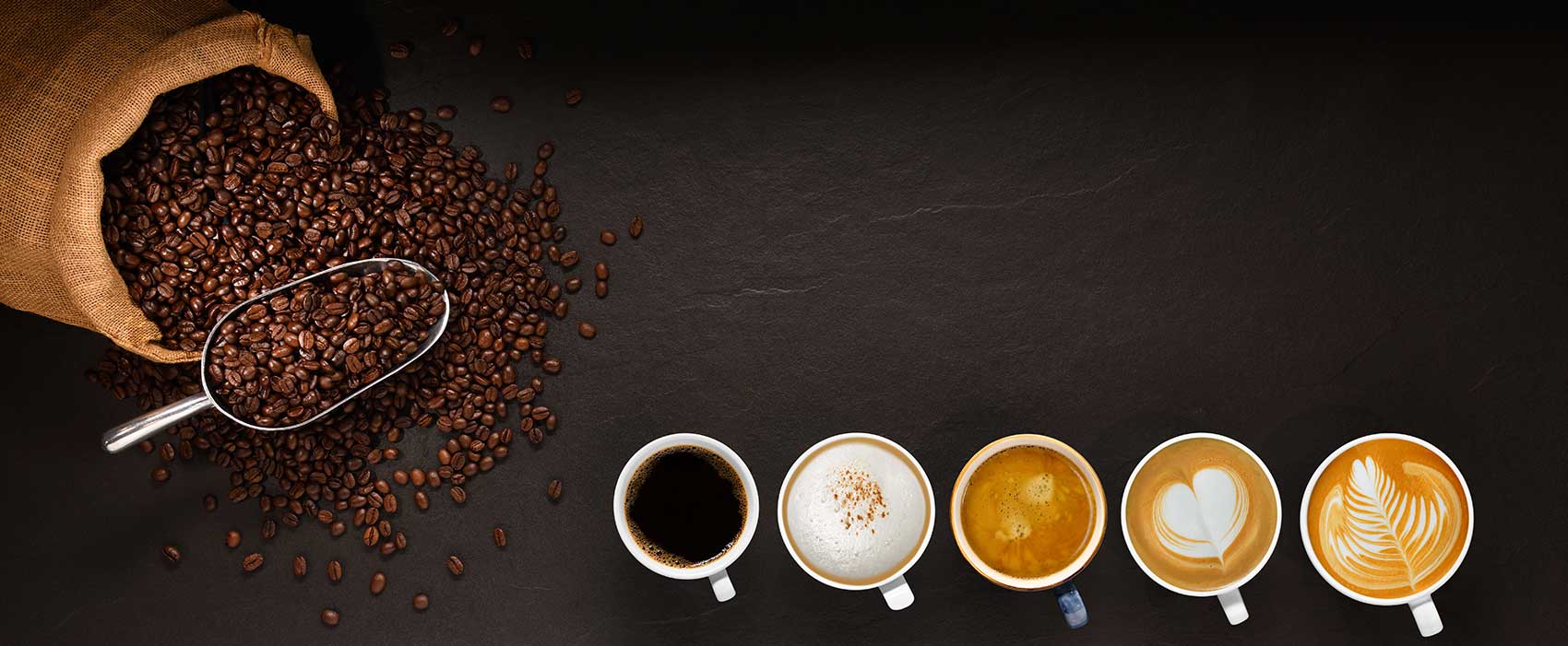 coffee beans and coffee mugs on table
