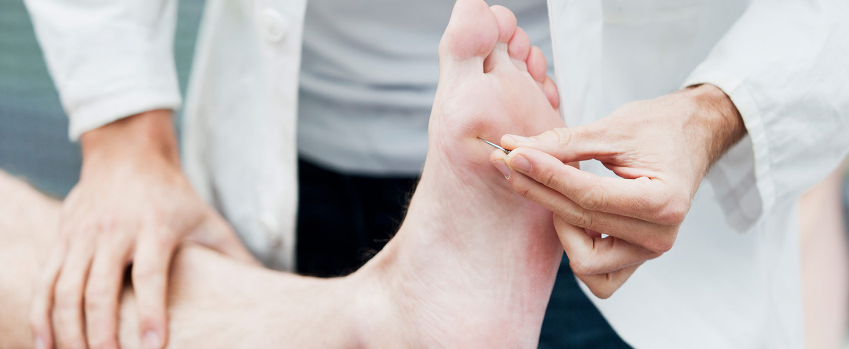 pin prick test on foot by doctor