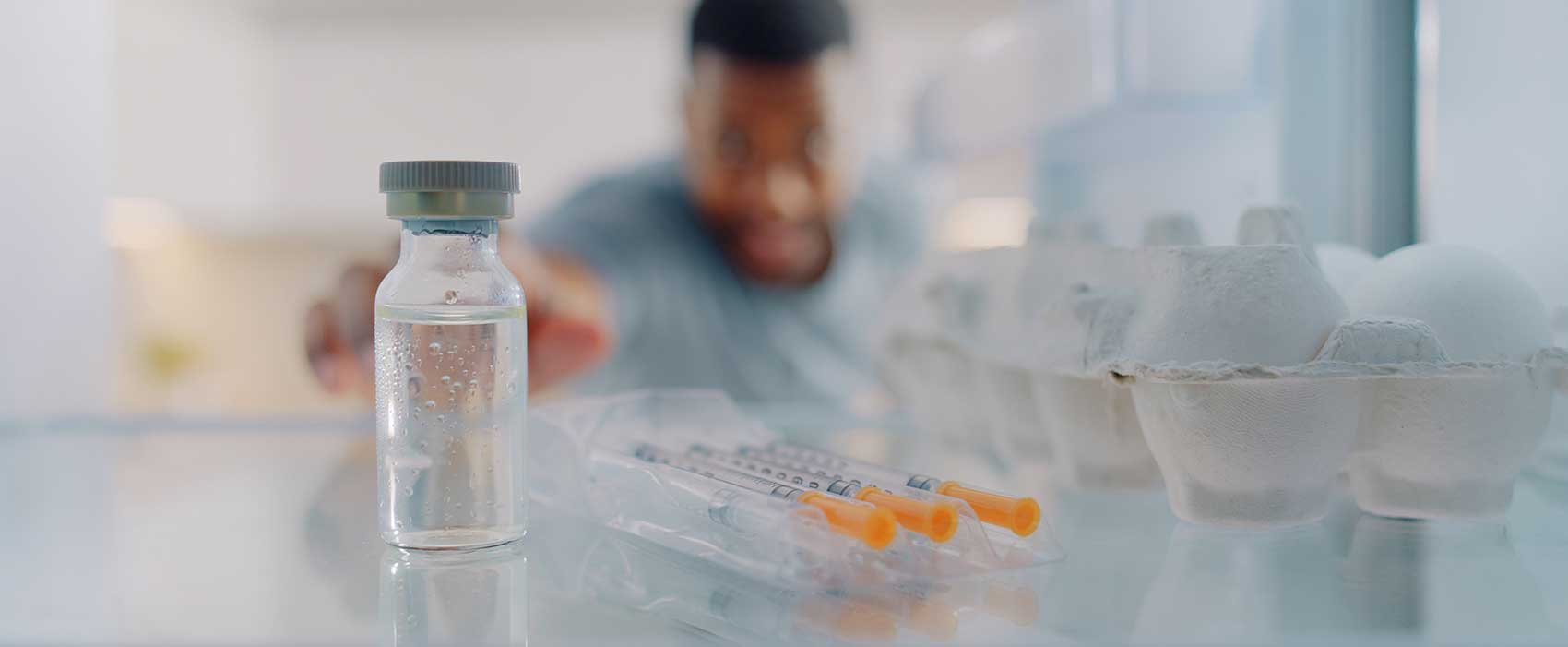 man reaching into fridge for insulin