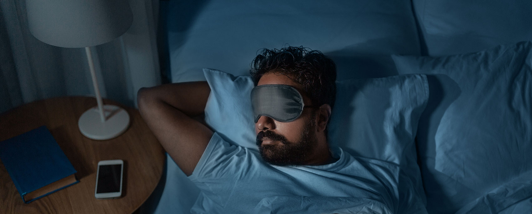 man sleeping in bed